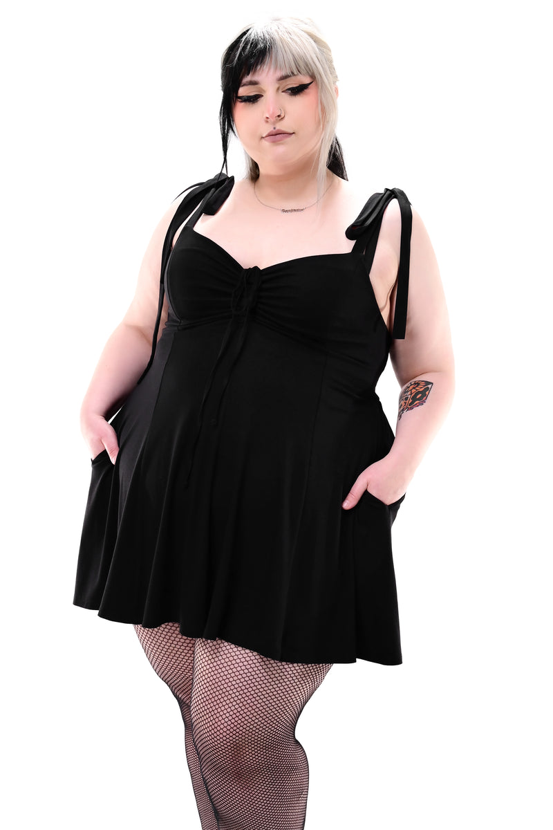 black skater dress with front ruching and adjustable tie straps