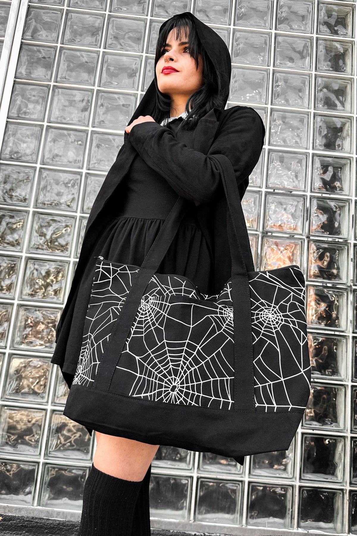 black zipper tote bag with all over cobwebs print