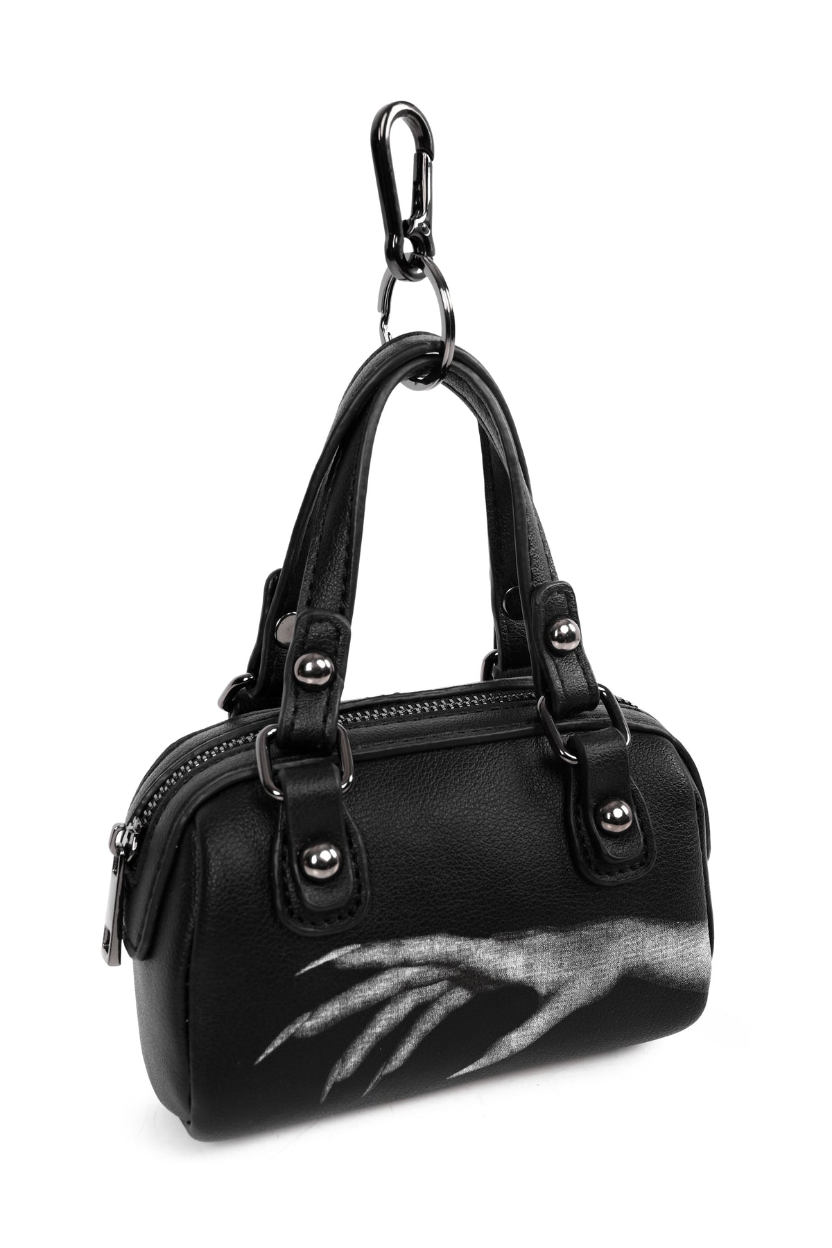 mini black bag with hand design on front and back with keychain attachment on handles