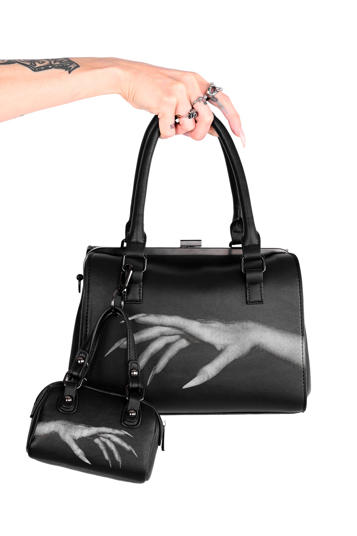 black bag with hand design on front and back
