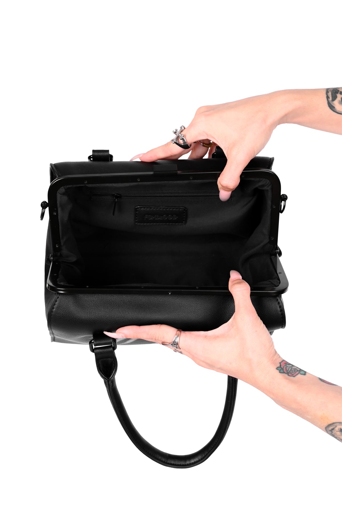 black bag with hand design on front and back