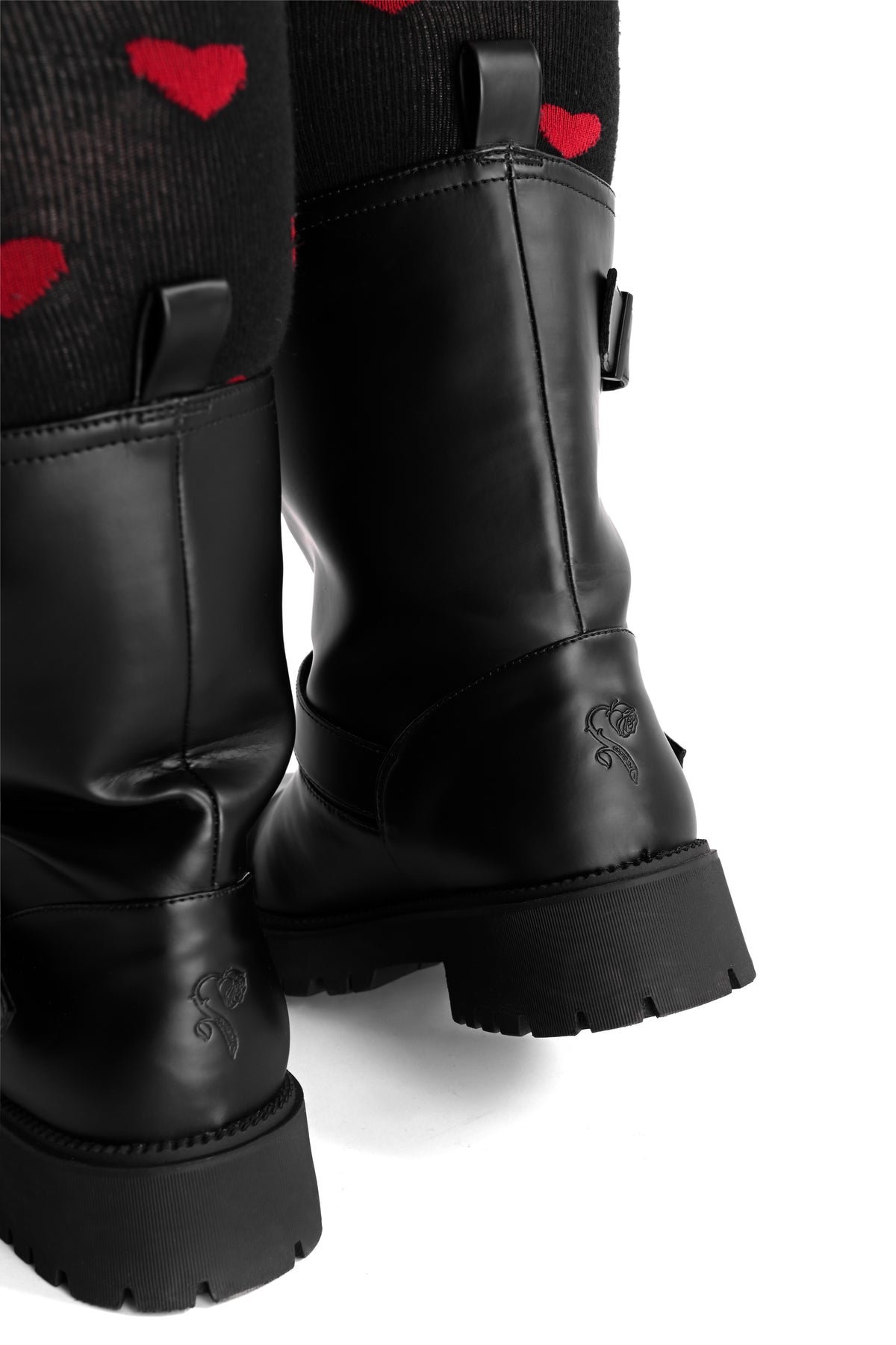 black rainboots with buckles and straps