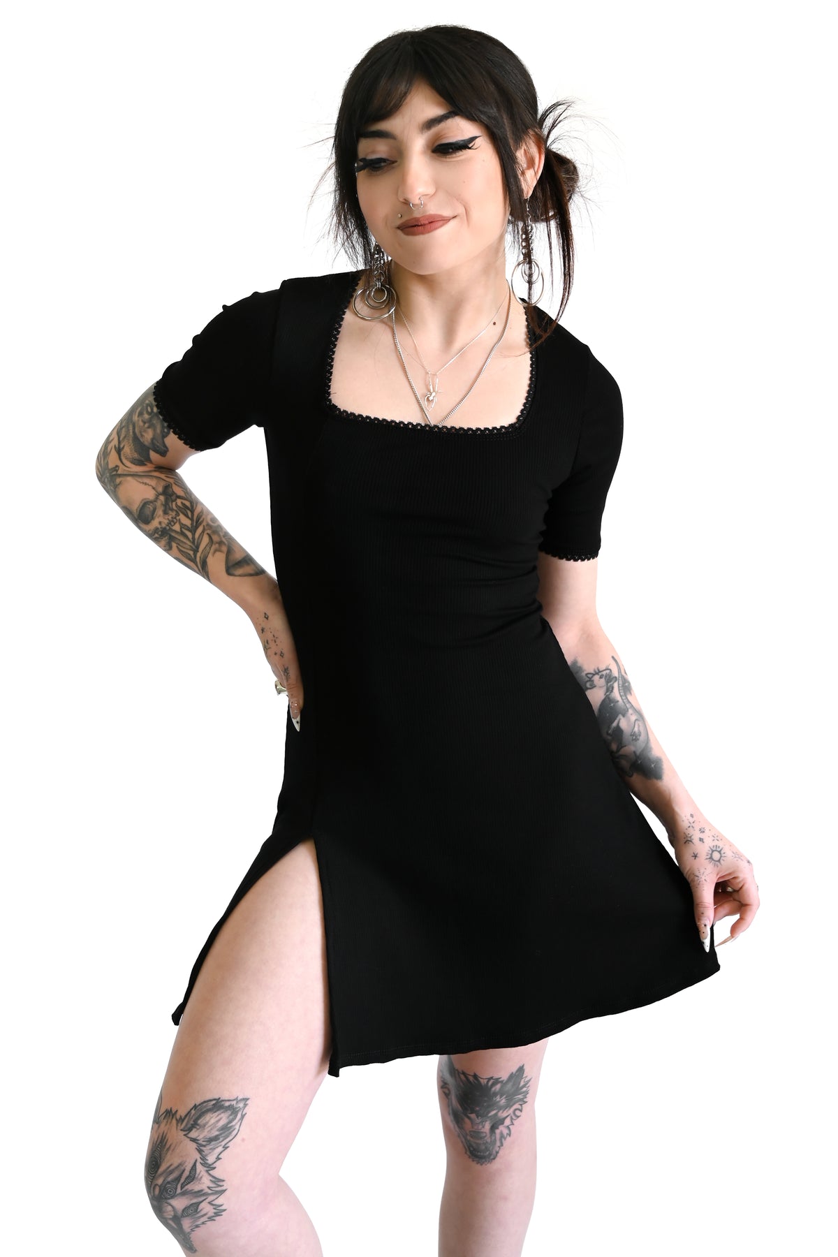 black ribbed mini dress with lace trim and dramatic side slit