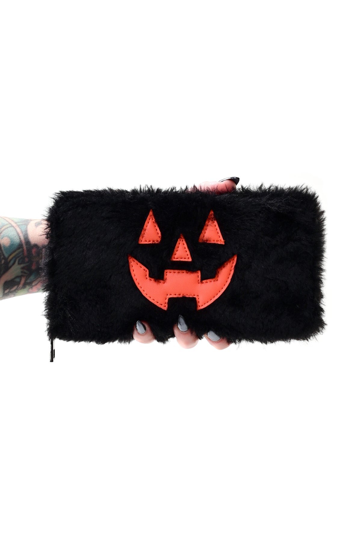 black faux fur zip around wallet with orange vegan leather jackolantern face overlay design