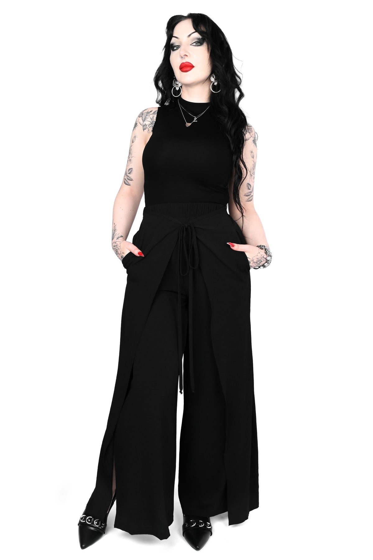 Black wide leg pants featuring a a wrap waist with adjustable tie.