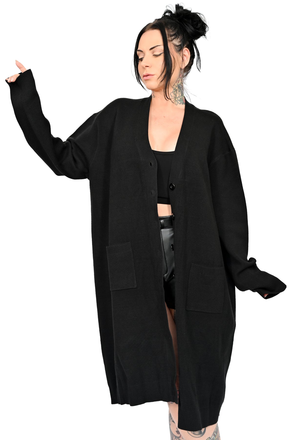 black sweater duster with green glow in the dark jackolantern face on back