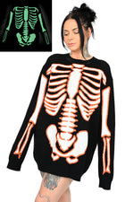 black sweater with orange and glow in the dark white skeleton print on front and back