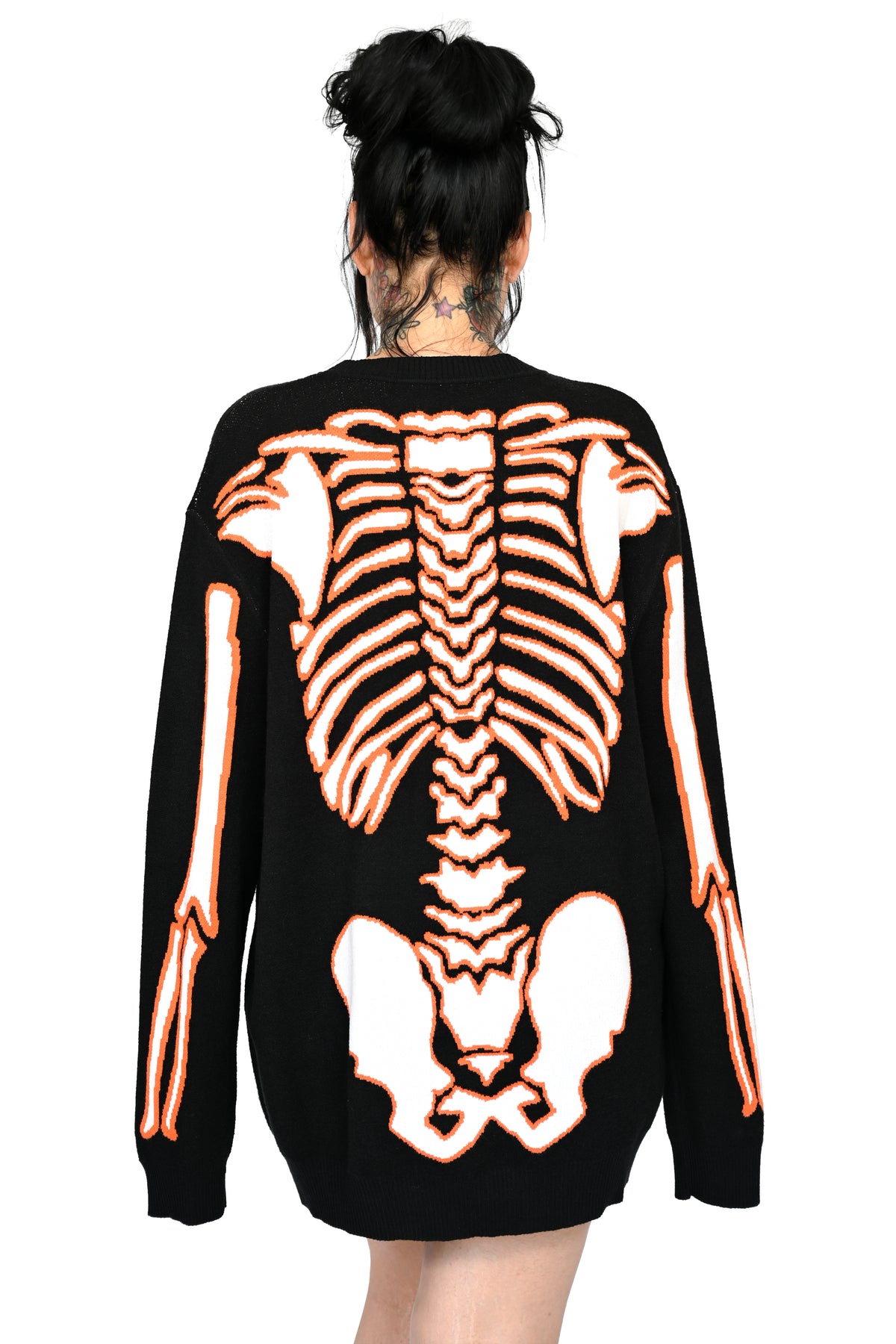 black sweater with orange and glow in the dark white skeleton print on front and back