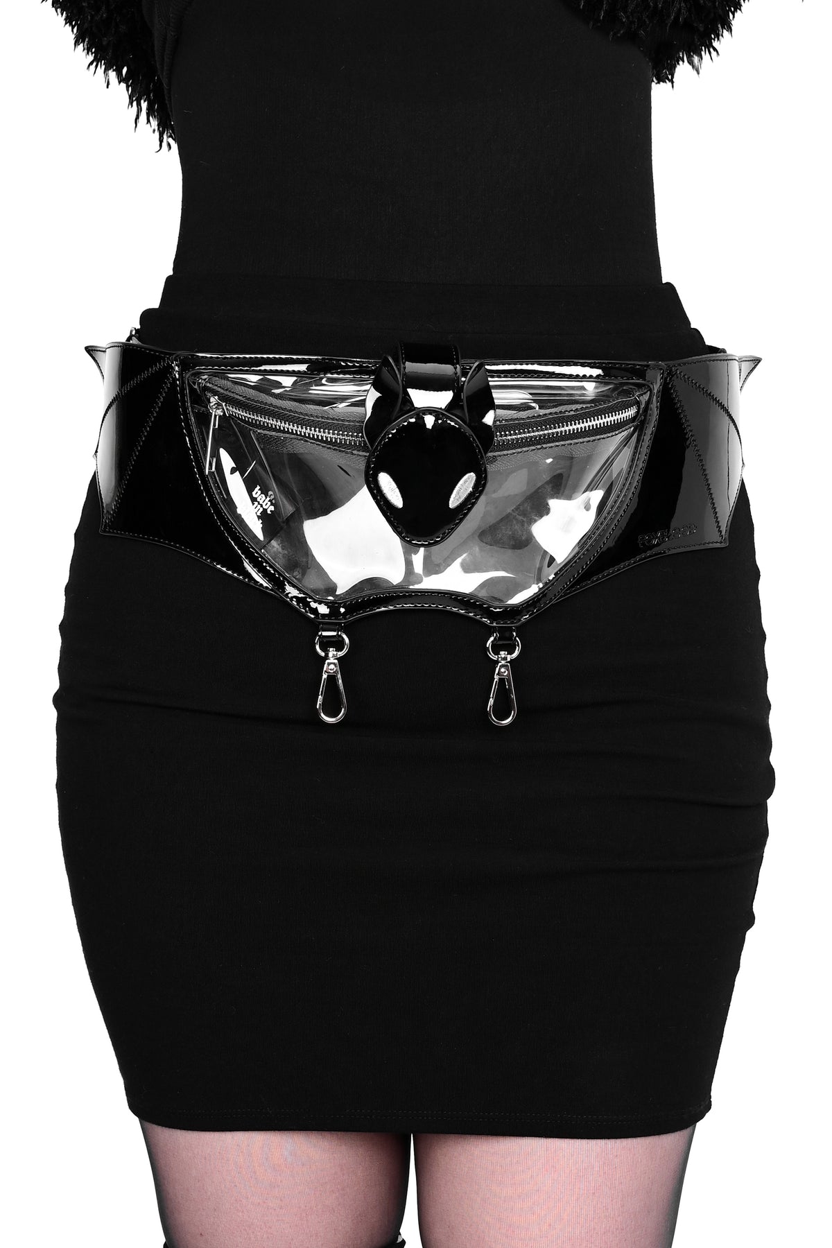 clear pvc fannypack in the shape of a bat with black patent pvc details, silver hardware, and 2 silver clasps on the bottom