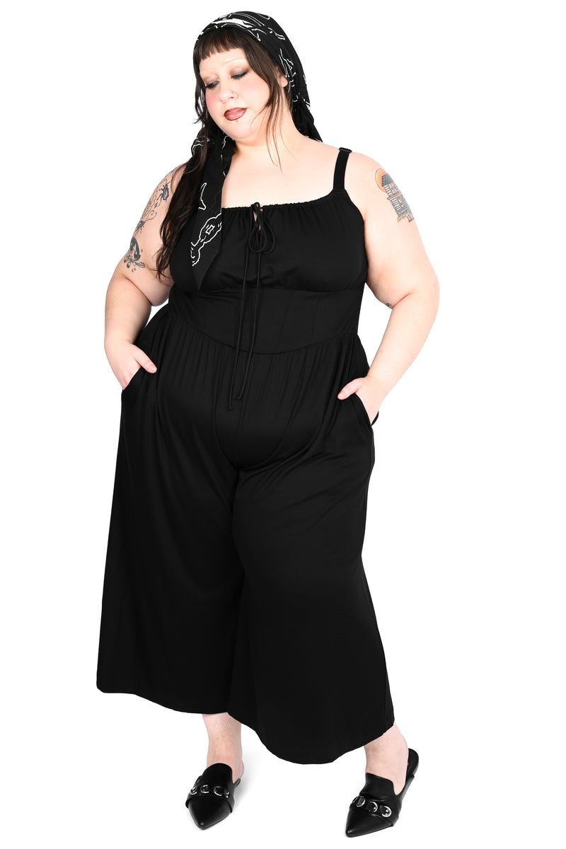 Black wide leg jumpsuit with keyhole tie on front.
