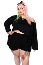 oversized crop bishop sleeve top and loose shorts with an elastic waist.