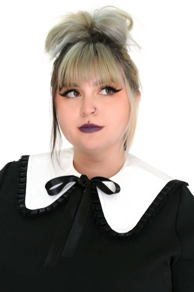 white detachable collar with black ribbon trim and tie