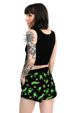 black high waisted lounge shorts with green glow in the dark bug pattern