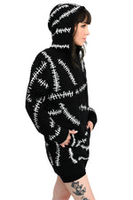 black hoodie with white glow in the dark stitch pattern