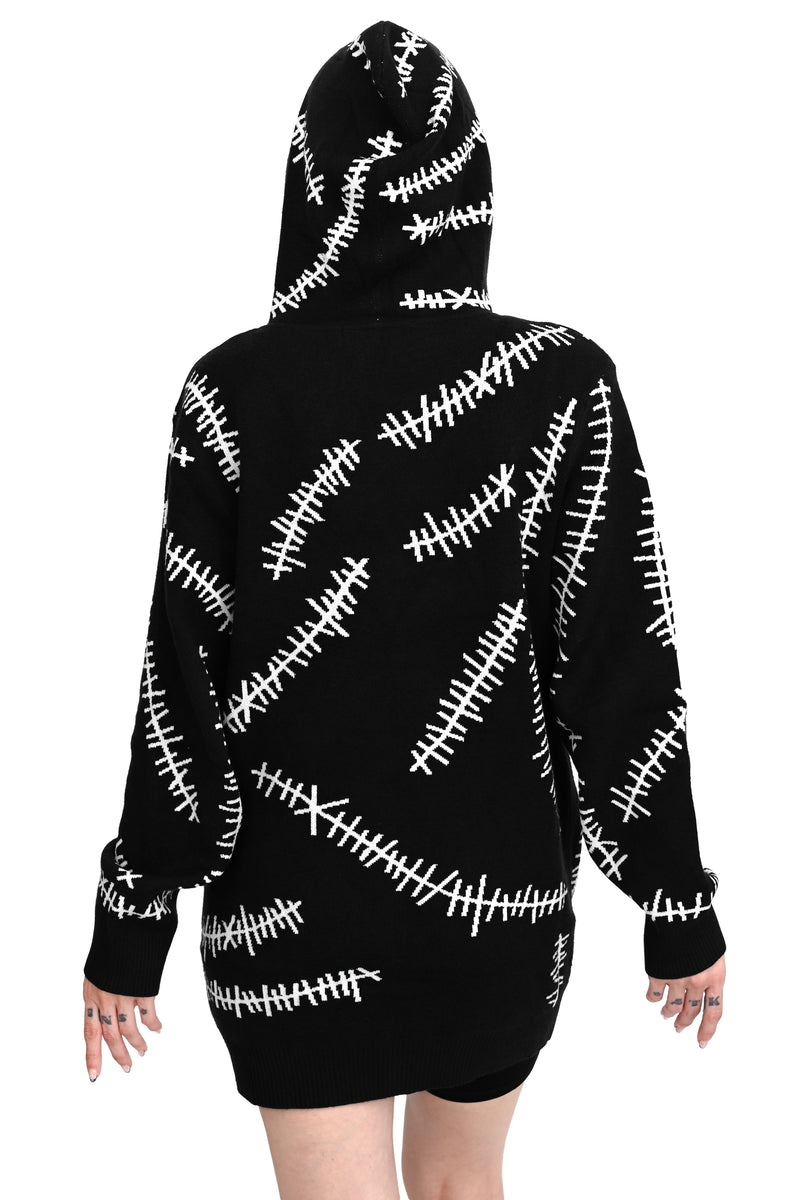 black hoodie with white glow in the dark stitch pattern