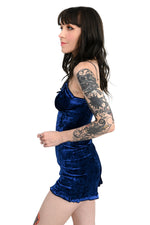 blue velvet romper with ruffle trim