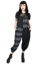 black and grey colorblock overalls with harlequin diamond print and front pom poms
