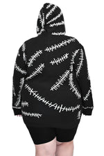 black hoodie with white glow in the dark stitch pattern