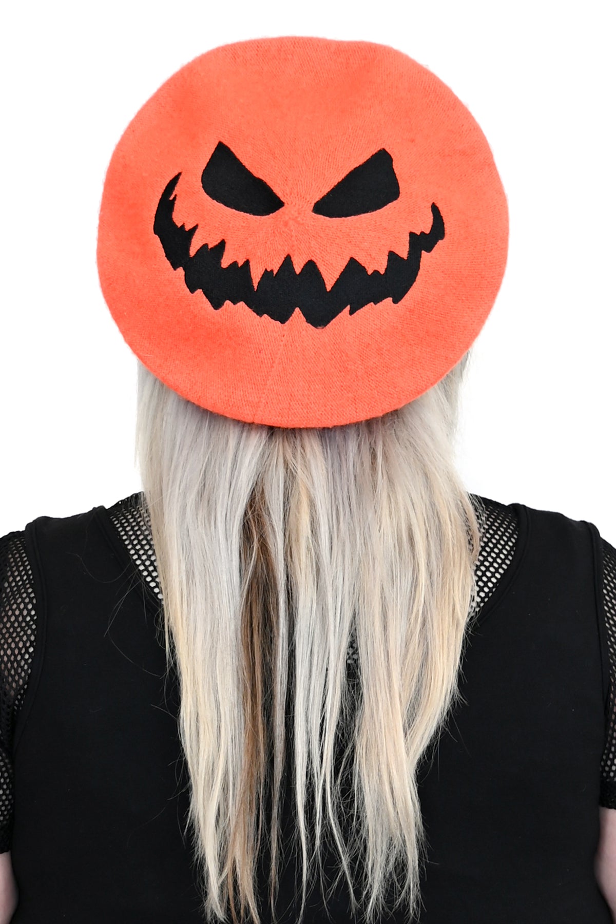 orange beret with embroidered black jackolantern face