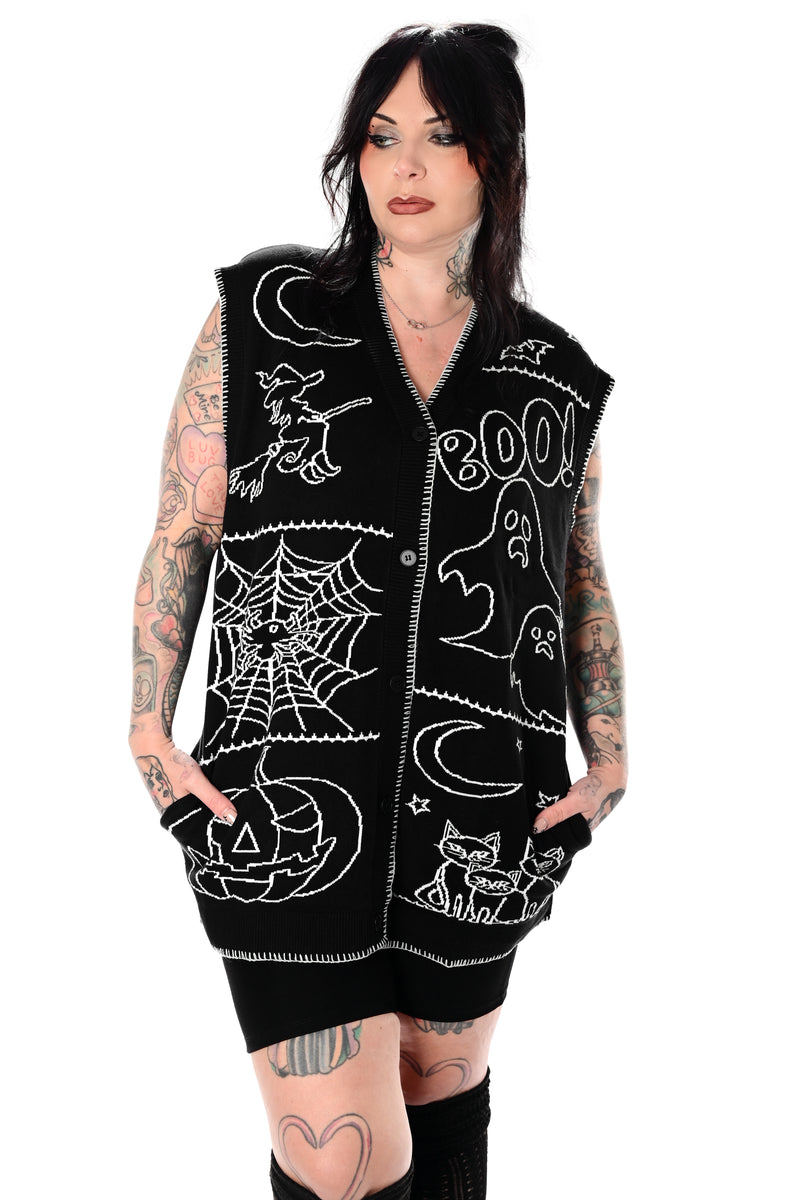 black button up sweater vest with halloween patchwork pattern and white stitching