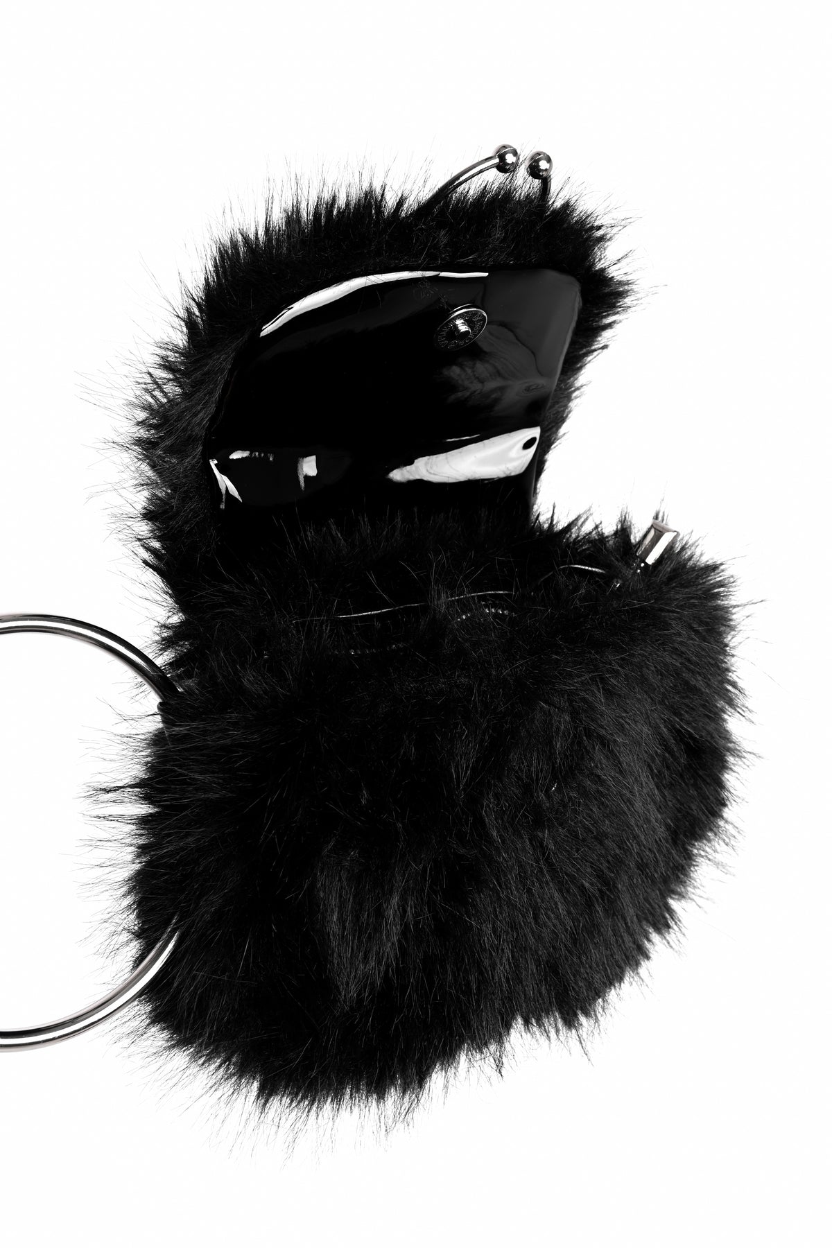 A black faux fur keychain pouch with a glossy black plastic keyring insert and silver metal keyring loops, shown on a plain white background, shot open so you can see under the front of the bag.