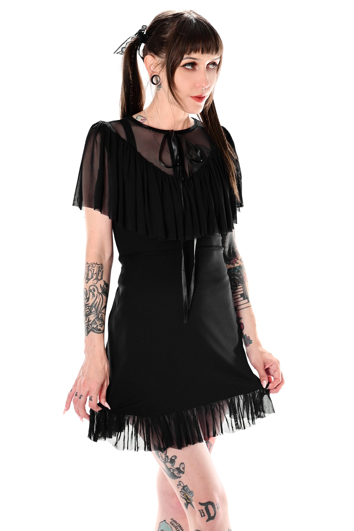 Black mini dress with a soft upper mesh ruffle neckline and mesh bottom hem