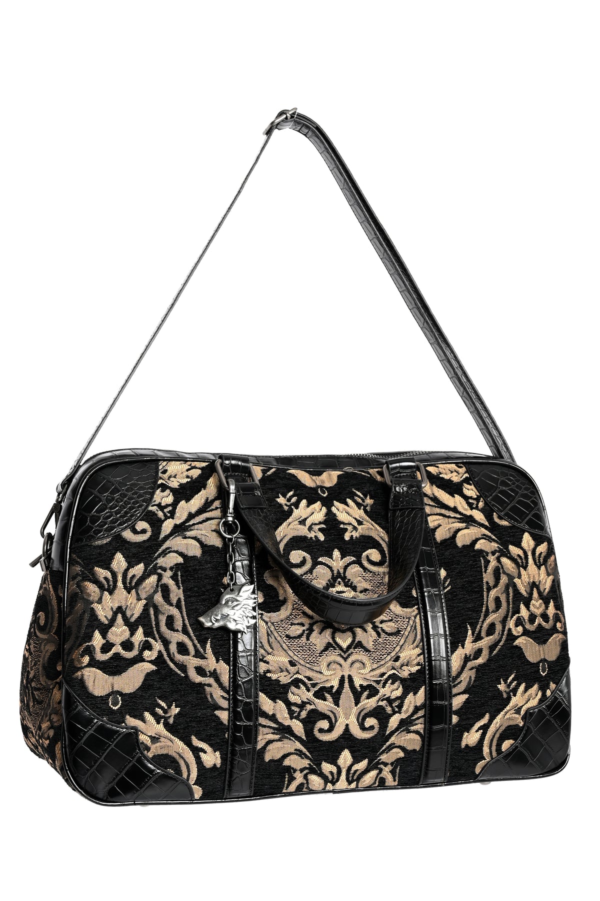 A black and beige/gold damask-patterned duffel bag with textured crocodile-embossed panels, black leather handles, a shoulder strap, and a silver-tone keychain charm, shown on a plain white background.