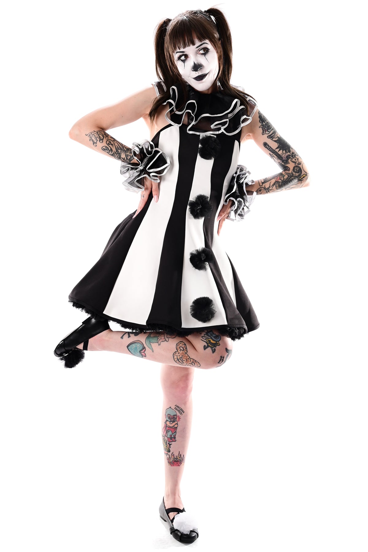 black and white striped clown dress with black tulle pom poms on front