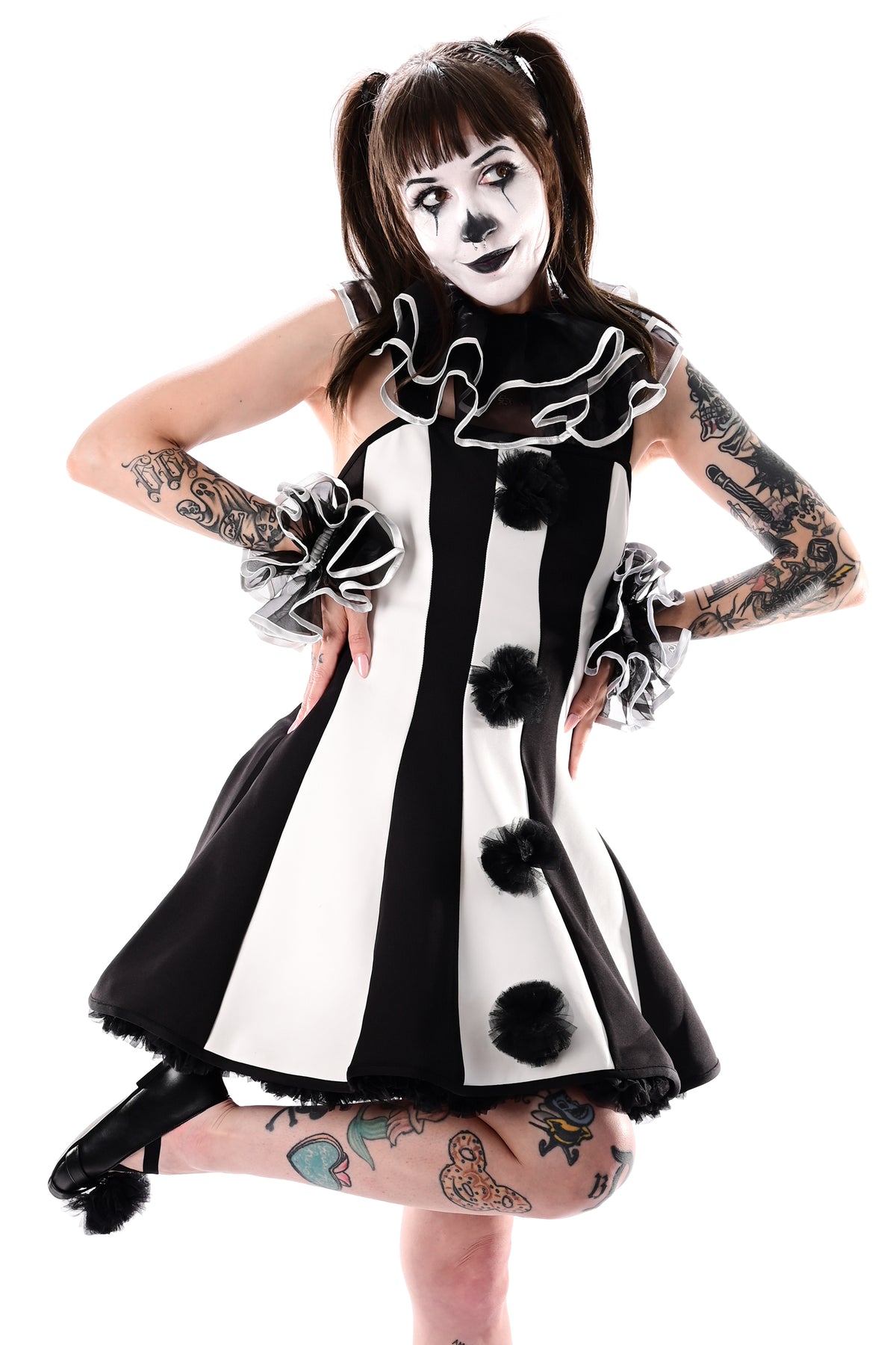 black and white striped clown dress with black tulle pom poms on front