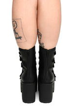 black chunky platform boots with silver buckles