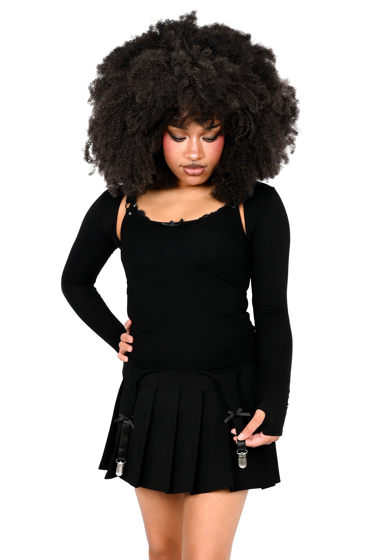Cami tank top with adjustable garter detail on the bottom. O-ring and satin bow details.