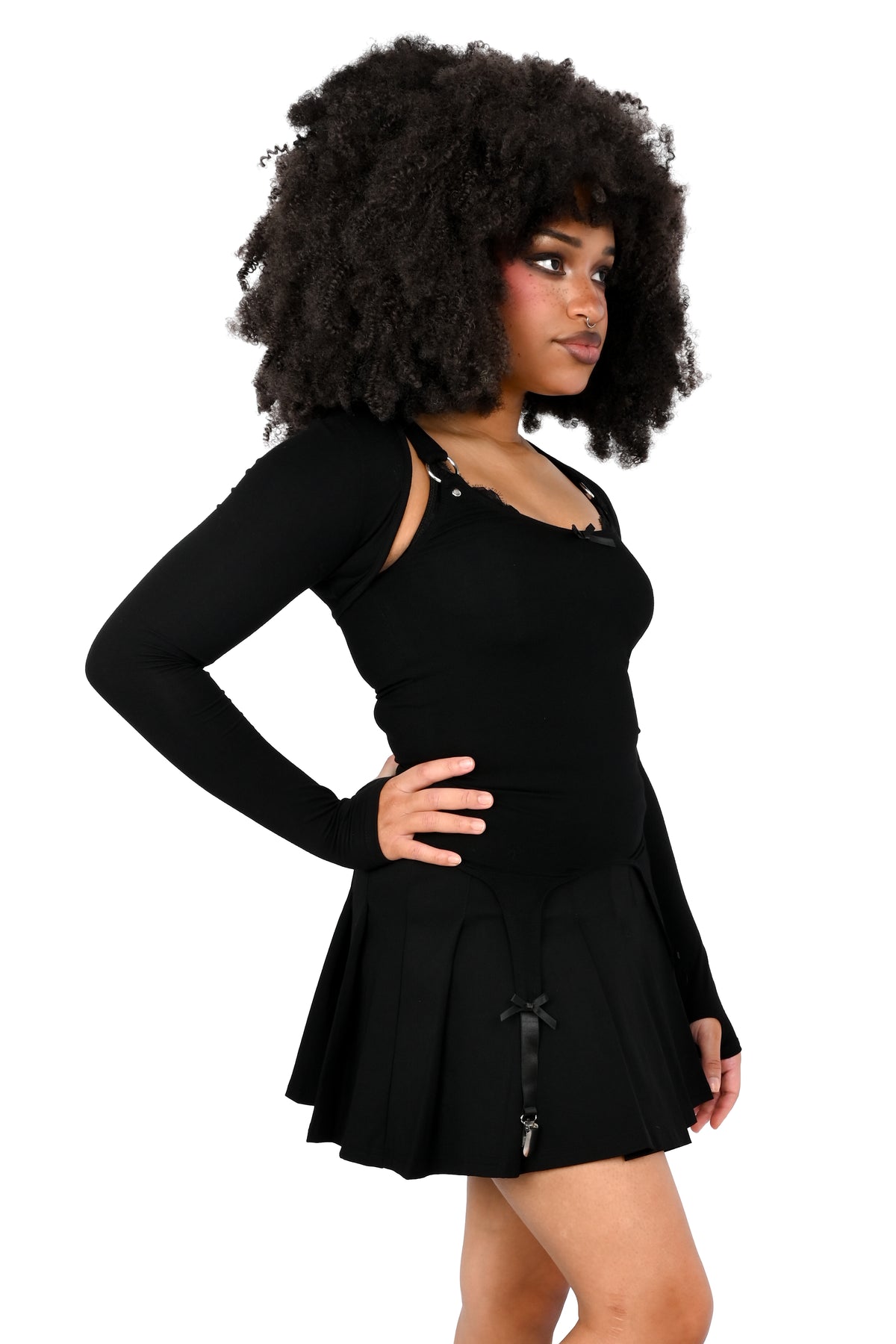 Cami tank top with adjustable garter detail on the bottom. O-ring and satin bow details.