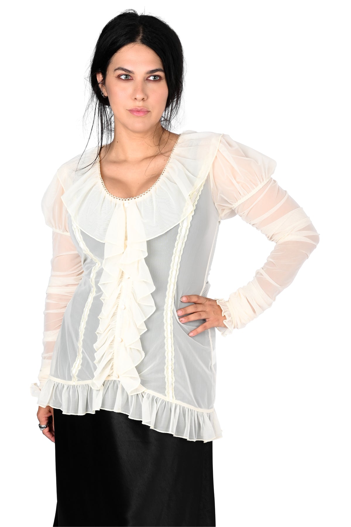 A woman modeling a sheer white long-sleeve blouse with layered ruffles and a ruffled neckline in size medium, paired with a black skirt, against a plain white background.