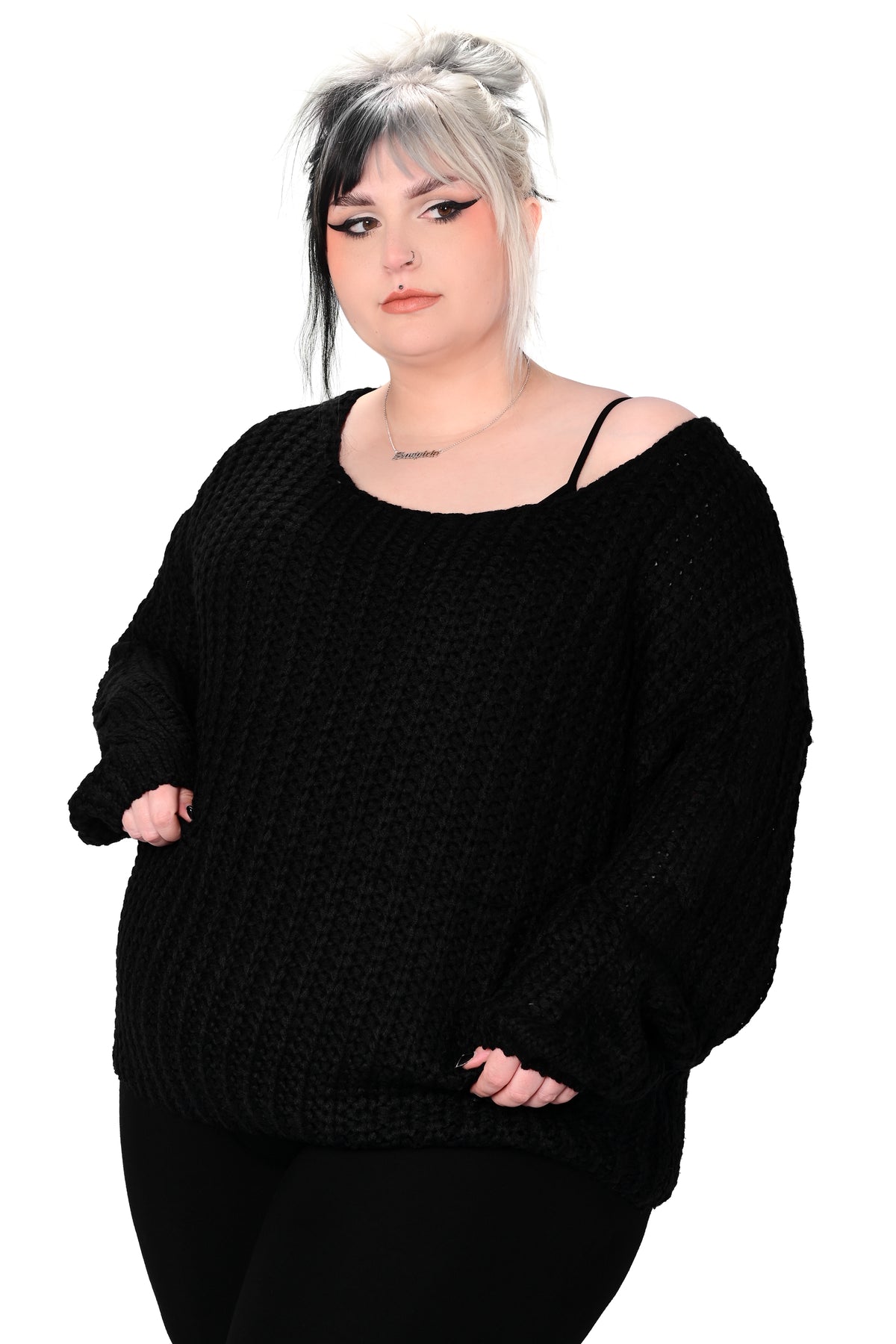 Soft, black pullover sweater with boat neckline