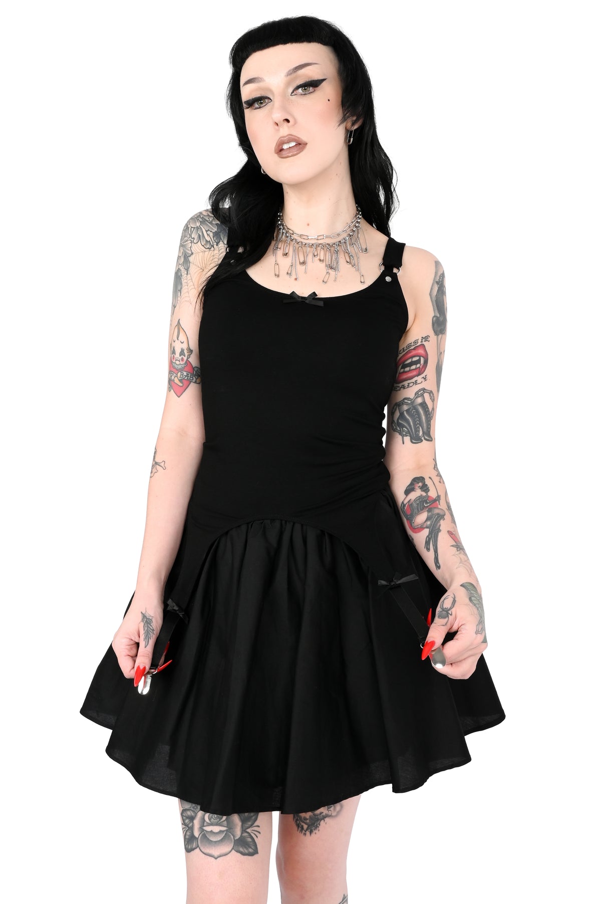 Cami tank top with adjustable garter detail on the bottom. O-ring and satin bow details.