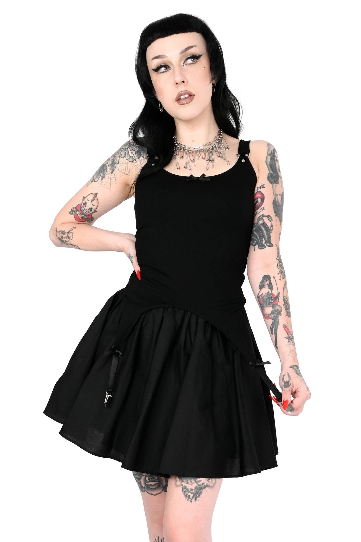 Cami tank top with adjustable garter detail on the bottom. O-ring and satin bow details.