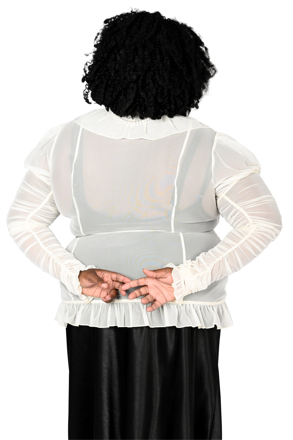 back view of a model wearing a cream sheer ruffle top with satin lace details in size 2xl