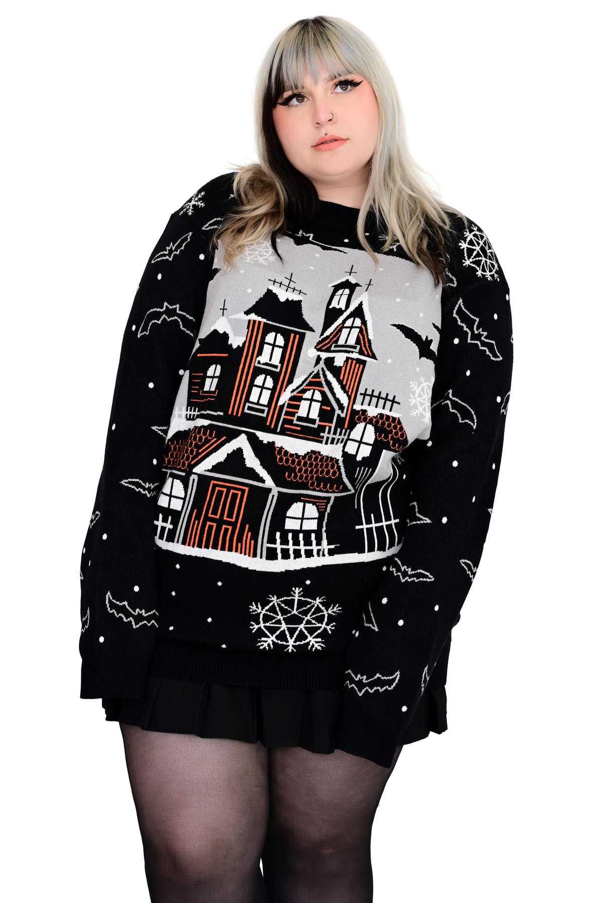 black pullover sweater with spooky snowglobe scene, bats, snow and snowflakes