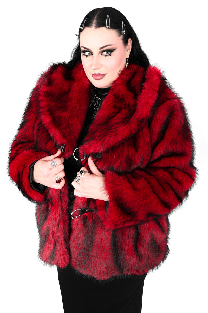 red faux fur jacket with 3 silver horseshoe piercing closures on front