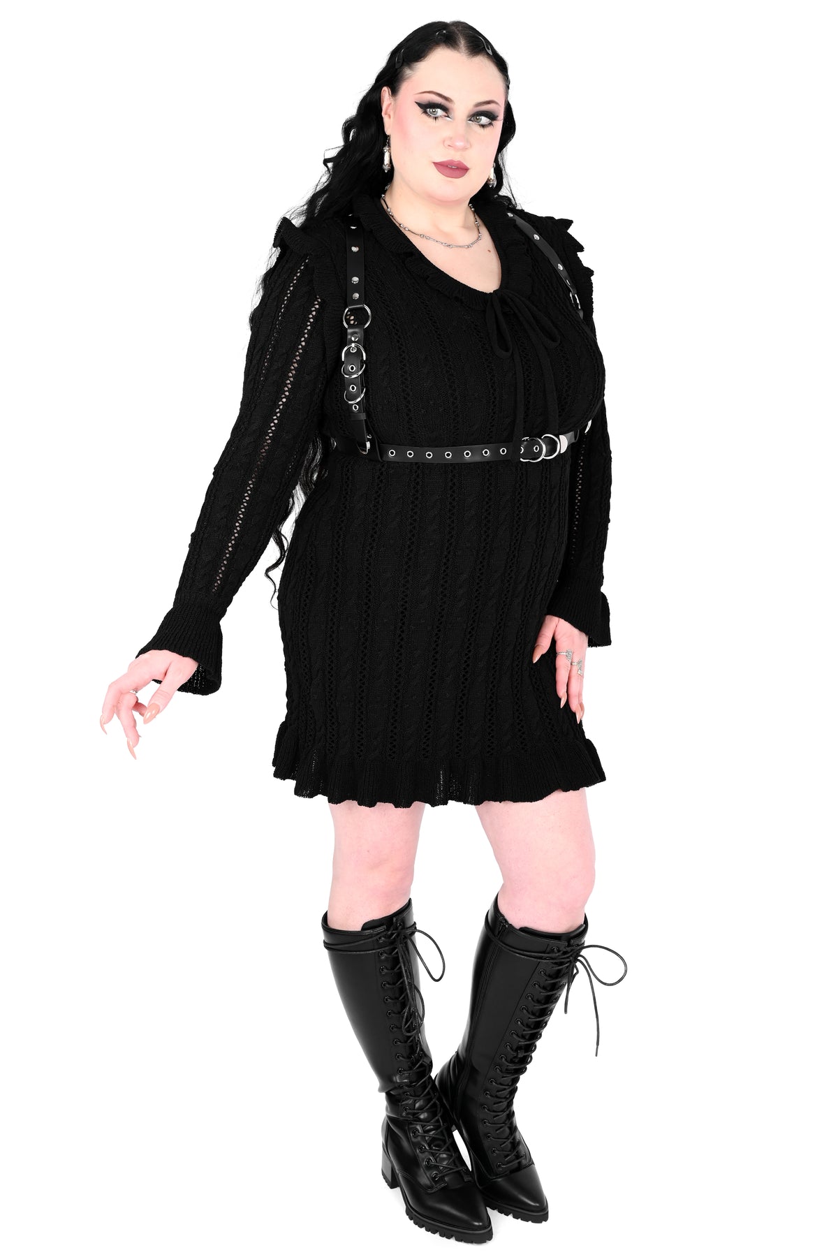 Black sweater dress with cute ruffly shoulders, bottom hem and tie neckline.