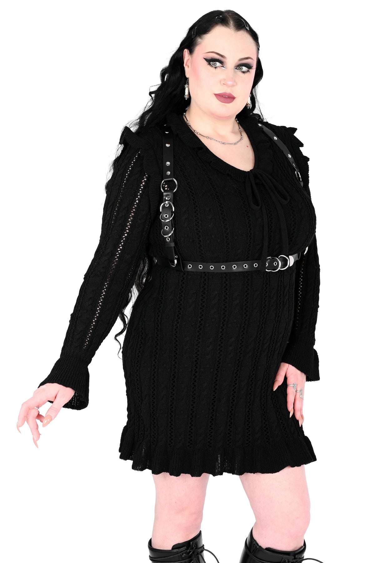 Black sweater dress with cute ruffly shoulders, bottom hem and tie neckline.