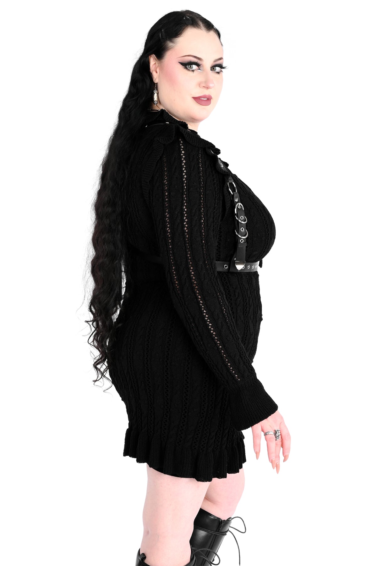 Black sweater dress with cute ruffly shoulders, bottom hem and tie neckline.