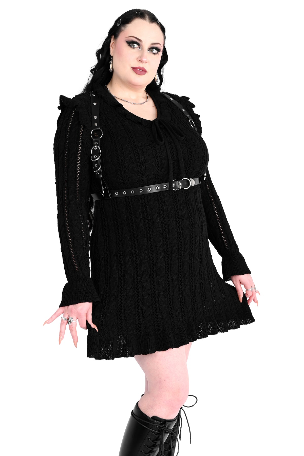 Black sweater dress with cute ruffly shoulders, bottom hem and tie neckline.