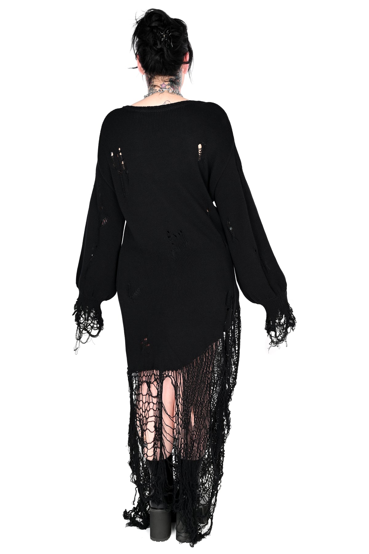 A model shown from the back wearing a black distressed long-sleeve top with lace trim set against a plain white background.