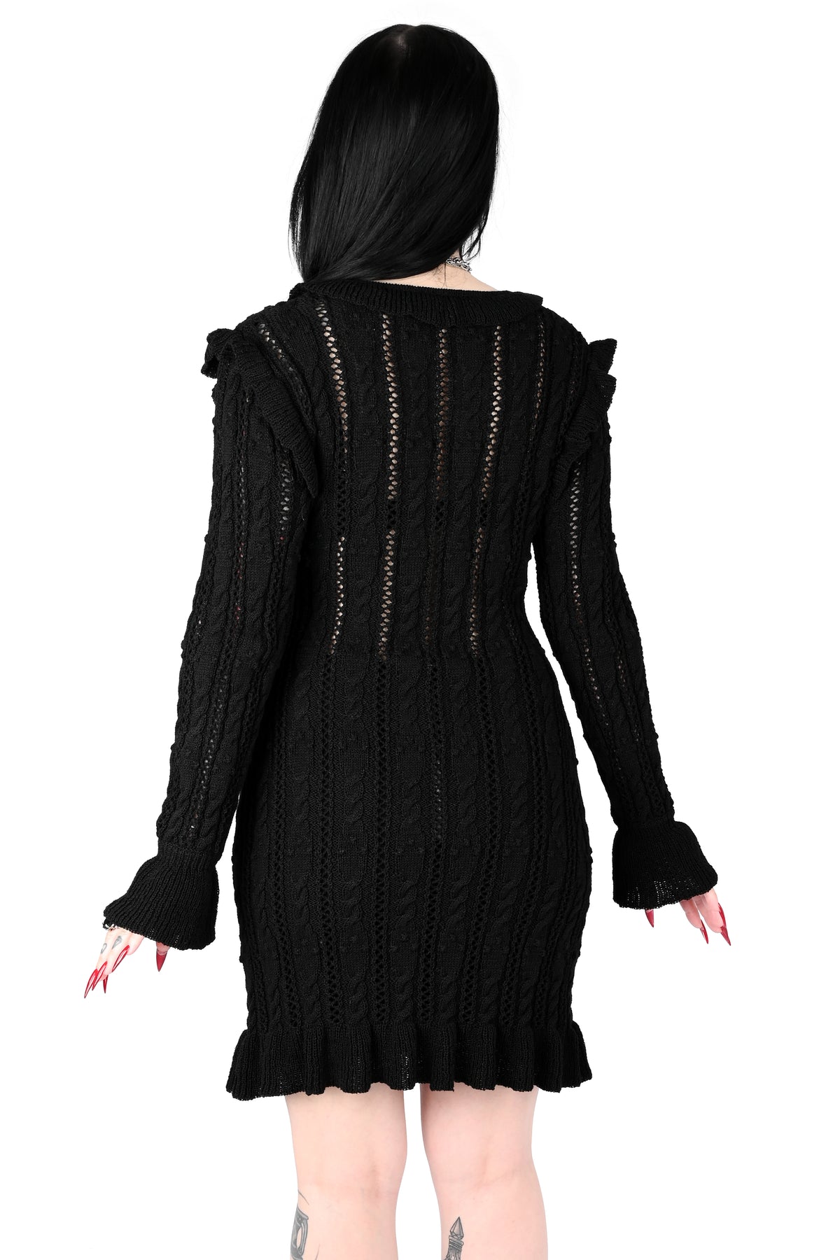 Black sweater dress with cute ruffly shoulders, bottom hem and tie neckline.