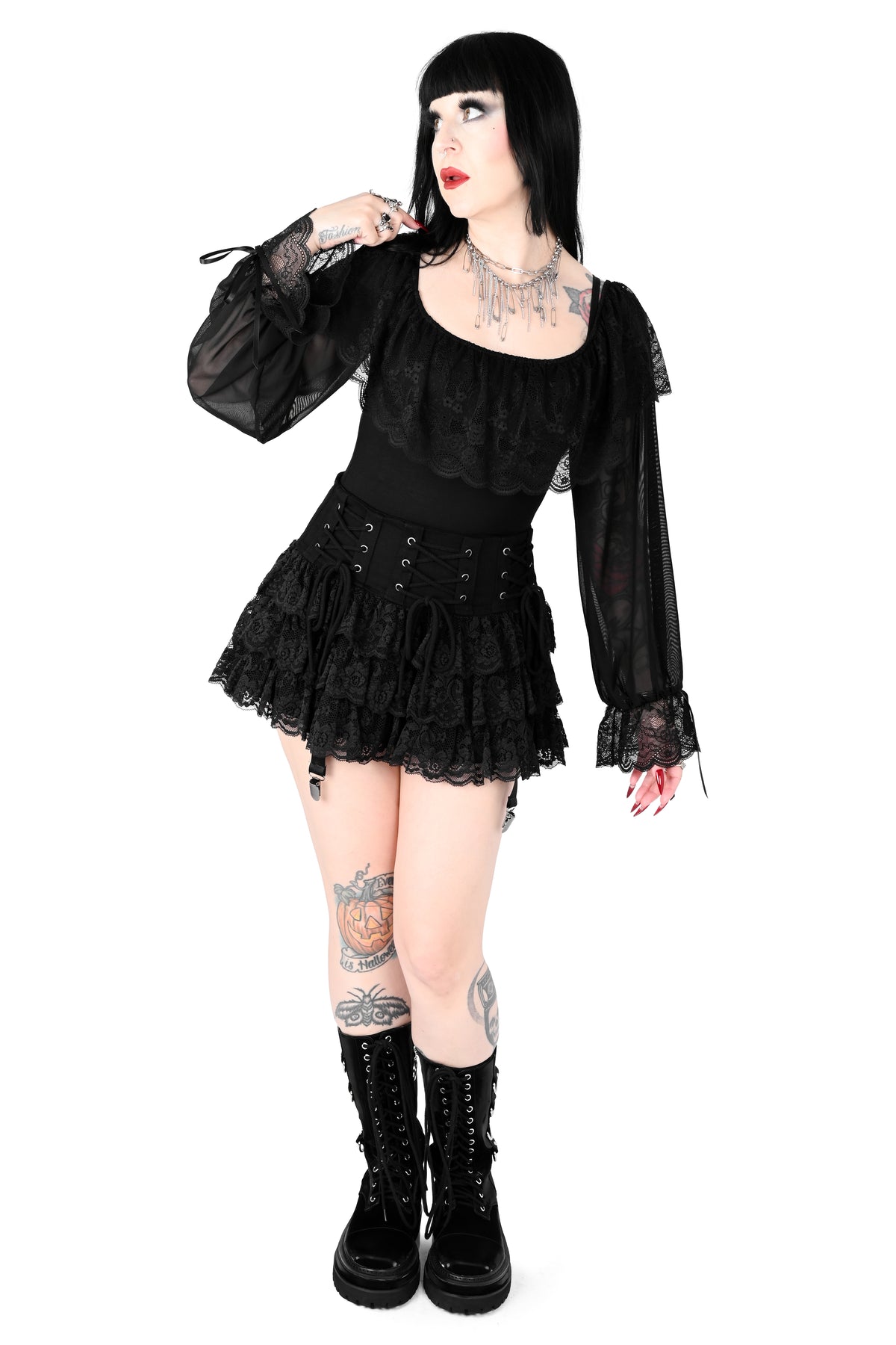 Mini skirt with adjustable lacing on the hip and ruffly lace.