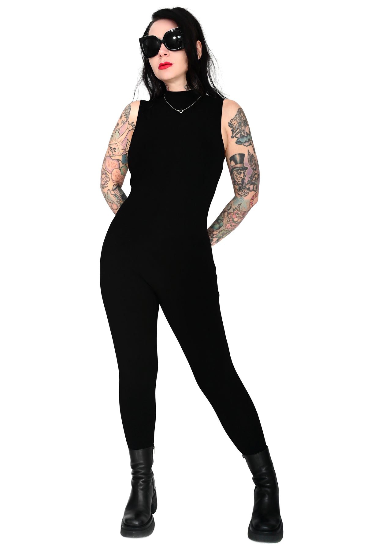 black sleeveless high neck catsuit on a size M model