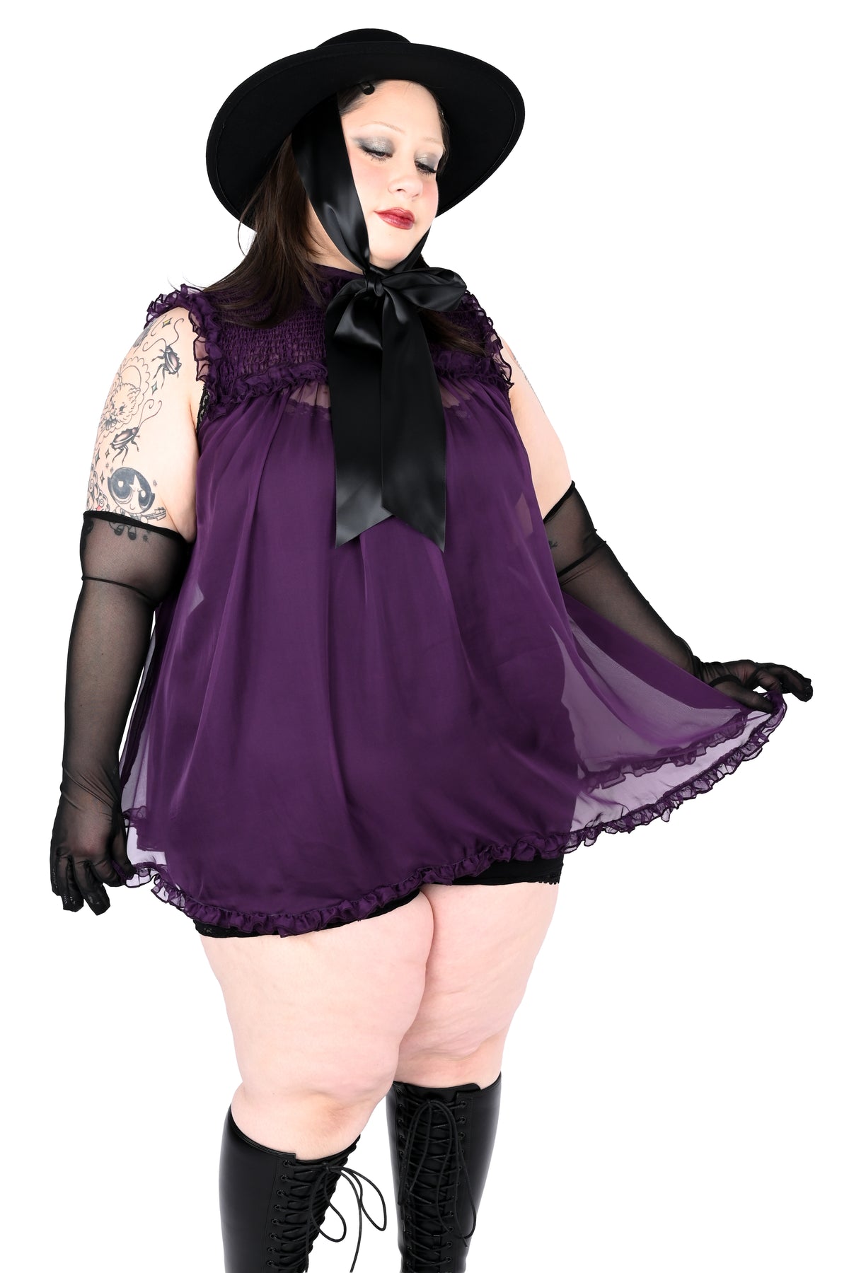 deep purple chiffon babydoll dress with smocking on the neckline and ruffle bottom hem
