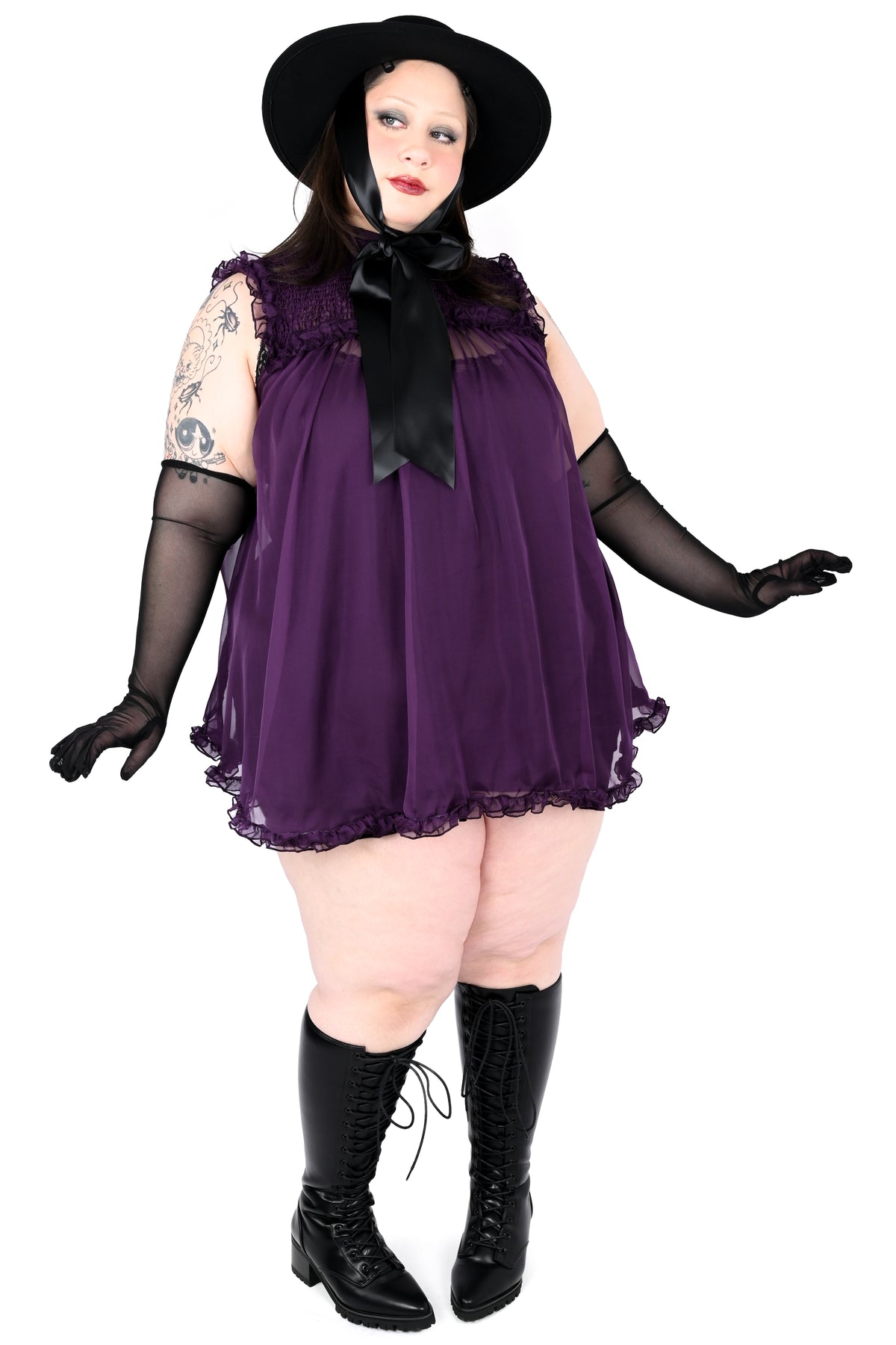 deep purple chiffon babydoll dress with smocking on the neckline and ruffle bottom hem