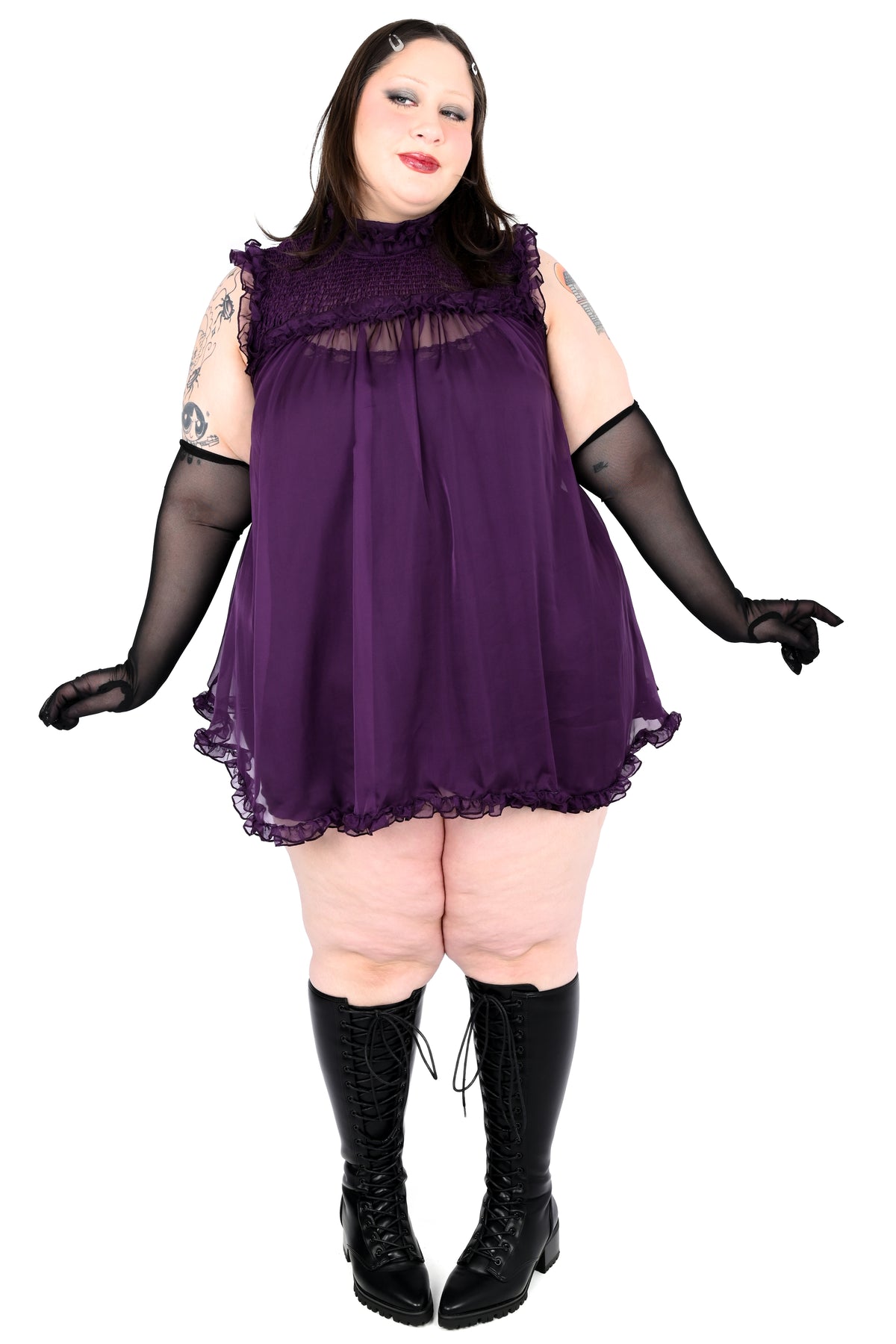 deep purple chiffon babydoll dress with smocking on the neckline and ruffle bottom hem